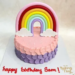 Taste the rainbow! This cute cake features a fondant rainbow topper and a colorful petal-piping effect on the side.