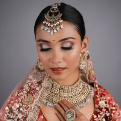 This pastel-themed bridal look was created by a student, showcasing their ability to work with modern color palettes and create soft, elegant makeup.