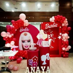 We created this vibrant Barbie setup for Anaya's fifth birthday bash. The red and pink color scheme is bold and fun, with a large doll box and character cutouts for the perfect photo ops.