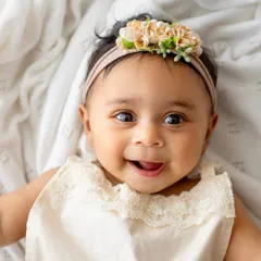 Oh, that smile! This is from a 6-month milestone session, and it's pure magic. I focus on capturing these simple, authentic expressions up close because they are the ones you'll want to remember forever.