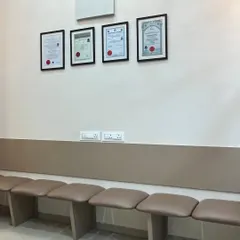 The patient waiting lounge is designed for your comfort. You can see my framed certifications in the background, which represent my dedication to qualified, expert care.