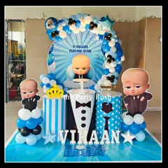 Vihaan's Boss Baby-themed first birthday featured a dynamic blue backdrop and character cutouts. I used striped and polka-dotted plinths, along with a crown prop, to celebrate the little boss in style.