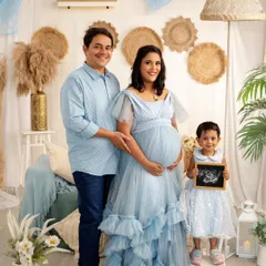 Your maternity session is a celebration for the whole family. I love capturing these moments of joy, like this big sister proudly announcing her new sibling in our light and airy boho-themed studio setup.