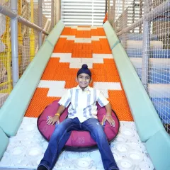Get ready for our crowd favorite, the Donut Slide. Kids love the thrill of sliding down on these comfy tubes, and they always come back for more.