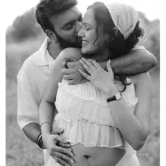 In the quiet moments, the deepest stories are told. This intimate black and white portrait of a couple in a natural setting focuses purely on their connection, the gentle touch, and the shared smile, proving that the most powerful emotions need no color.