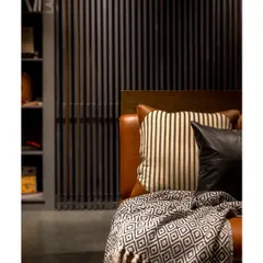 We created cozy nooks for client discussions, featuring comfortable leather seating and soft textiles. The slatted wooden screens provide a sense of privacy while maintaining the open feel of the showroom.
