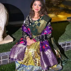 A modern take on South Indian bridal wear. This look combines a traditional half-saree drape with a contemporary velvet blouse and soft, glamorous makeup.