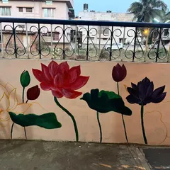 The completed lotus mural on my home's compound wall. The design features lotuses in various stages, from bud to full bloom, creating a tranquil and visually appealing piece of residential wall art.