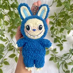 The trendy monster Labubu as a fluffy keychain. His unique look and soft texture make him a fun and eye-catching accessory.