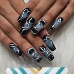 For a bold and edgy look, I created this smoky effect on long, square-shaped acrylic extensions. The design uses shades of black, grey, and silver chrome to create a sense of movement and depth.