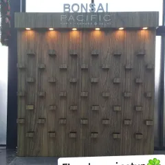 The foundational structure of the bonsai wall at Pacific Mall, complete with integrated shelving and overhead lighting. This custom-built framework is the first step in creating the stunning final installation.