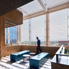 At the Mahindra office in Chakan, operable louvres on a breakout terrace provide shade and modulate airflow, a key feature of our climate-responsive design approach. This space allows employees to connect with the outdoors without compromising comfort.