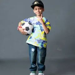 Ready to play! This young boy's energetic personality shines through in this fun, sporty portrait.