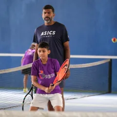 Rohan Bopanna stands with one of our young players, offering guidance and encouragement. This direct mentorship from a tennis icon is an invaluable part of the experience at our academy.