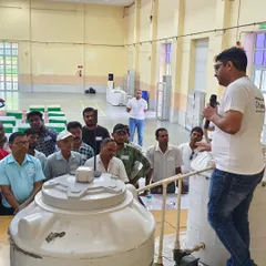 A live demonstration in action. We believe in showing, not just telling. Here, our expert is explaining the installation and functionality of the FloSenso device to an engaged group of our plumber partners.
