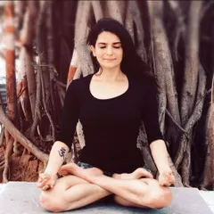 A moment of meditation in Padmasana (Lotus Pose) under a banyan tree. This is where I connect to my center, finding the stillness that I aim to share with all my students.
