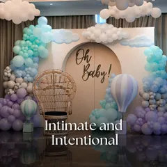A whimsical 'Oh Baby!' shower designed with intention and love. The theme was brought to life with a soft balloon installation resembling clouds, a classic peacock chair for the mother-to-be, and hot air balloon details for a touch of playful charm.