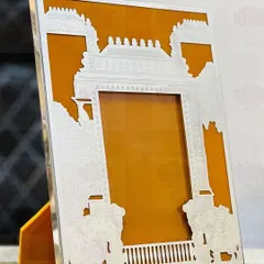 This stunning silver frame features a cutout of a royal procession, complete with elephants and a palace silhouette. It's a regal and artistic way to frame your favorite wedding photo.