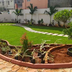 A look at a classic residential garden we recently completed. We installed a clean, curved stepping stone path through a vibrant green lawn and created raised, brick-edged garden beds to make planting and maintenance simple for the homeowner.