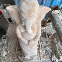 A different view of an unfinished Ganesha sculpture. At this stage, I focus on the overall balance and form, ensuring the proportions are right before moving on to the detailed work of the trunk, hands, and clothing.