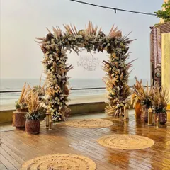 Another perspective of the proposal setup, showing the arrangement of jute rugs and lanterns leading to the main arch. Every detail is planned to build up the perfect moment.