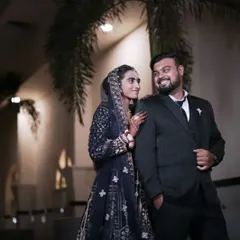 An elegant reception portrait under the stars. We excel at night photography, using professional lighting to capture the glamour and intimacy of your post-wedding celebrations.
