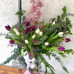 A beautiful shot of one of my favorite vase arrangements, featuring a mix of tulips and orchids. This is the kind of floral design that makes any day feel special.
