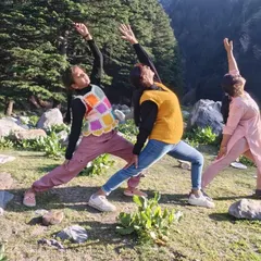 Three generations, one yoga pose. Practicing Reverse Warrior together in nature, showing that yoga is a practice for everyone, uniting us across ages.