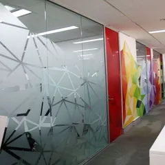 This geometric frosted glass film adds a modern, professional look to an office space. It provides necessary privacy for meetings while enhancing the interior design with a sharp, contemporary pattern.