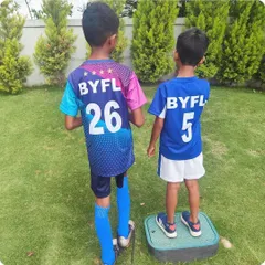 How it's going. The two brothers stand side-by-side in their respective BYFL jerseys, a powerful symbol of family, passion, and a shared love for football.