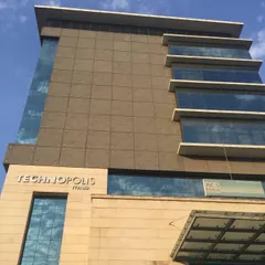 A clear shot of the Technopolis IT Hub building name and facade. The use of stone cladding and glass creates a professional and lasting aesthetic that has served its tenants well over the years.