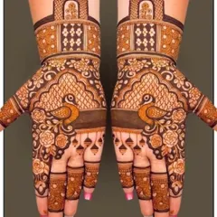 A very graceful design featuring peacocks on the palms, surrounded by floral patterns and topped with architectural domes.