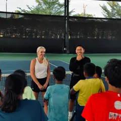 Our young players listen intently during an interactive session with a professional athlete. We create an environment where students can ask questions and learn directly from their idols.