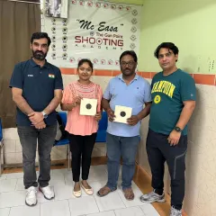 A proud moment for these new shooters after completing their first session. They are holding up their targets, showing the great results of their focus and my coaching.