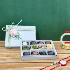 A beautiful combination box featuring six pieces of my artisanal mithai and six handmade chocolate pralines. It's the best of both worlds for those who can't decide between traditional and modern sweets.
