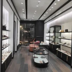 A view of the store's interior showcasing the product display strategy. We used a mix of open shelving and glass cases with specific lighting to highlight the merchandise.
