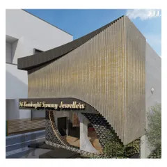 This angled view highlights the three-dimensional quality of the facade design. The way the curved entrance tucks under the main structure creates depth, while the textured materials provide tactile and visual interest from every approach.