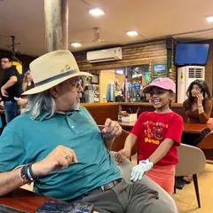 Sharing a laugh with one of our youngest and most enthusiastic players. It's moments like these that truly define our academy.
