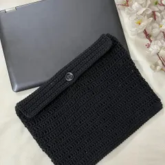 The back of the Pokémon laptop sleeve, showing the simple and secure button closure that keeps the laptop from sliding out.