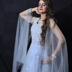 Feel like a princess in this powder blue gown with cape-like sleeves. The silver embroidery adds a touch of sparkle, making it perfect for a reception or engagement.