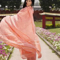 This shot captures the flow and elegance of a peach-colored ethnic suit from Janasya. The movement of the dupatta highlights the fabric's quality, creating a dynamic image perfect for brand lookbooks.
