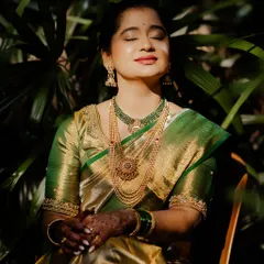 A moment of peace. A beautiful South Indian bride soaking in the morning sun just before her wedding ceremony begins.