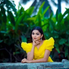A close-up of the yellow gown, highlighting the delicate off-shoulder design. It’s a favorite for photoshoots and special birthday celebrations.