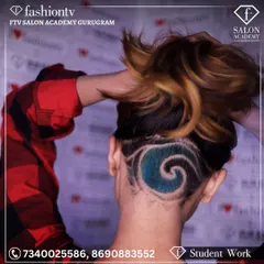 This edgy undercut with a colored wave design is a testament to our focus on modern, trend-setting hairstyling. Our students learn to push creative boundaries and master unique techniques.