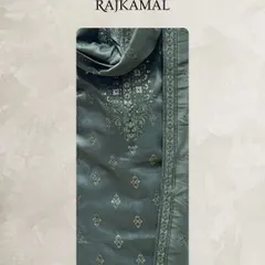 A detailed look at the fabric of the hunter green jacquard kurta, showing the subtle self-design and the embroidered neckline.