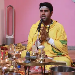 A priest leads the chanting during a puja ceremony at our center. These rituals are performed with meticulous care, creating a powerful atmosphere of devotion and sanctity.