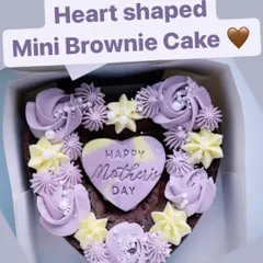 For the chocolate-loving mom, I created this heart-shaped mini brownie cake. It's a rich, fudgy brownie decorated with delicate buttercream swirls and a "Happy Mother's Day" plaque.