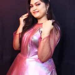 This metallic pink gown is a true party starter. The iridescent fabric catches the light beautifully, making it a perfect choice for evening events, fashion shows, or a glamorous birthday shoot.
