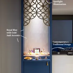 This striking blue mandir is accented with golden jaali patterns and spotlight illumination. The minimalist niche design creates a contemporary yet spiritual feel.