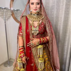 The complete look for my stunning Rajasthani bride. The makeup is rich and colorful, matching the grandeur of her traditional attire and jewelry.